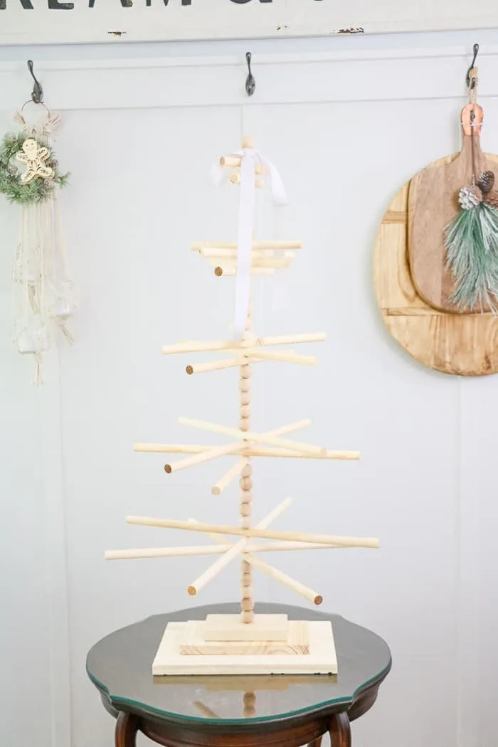 Wooden dowel Christmas tree designed for the kitchen with gingerbread ornaments. Finished tree
