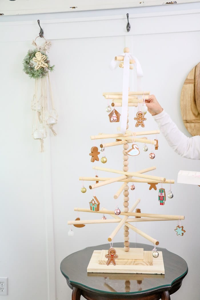 Wooden dowel Christmas tree designed for the kitchen with gingerbread ornaments.