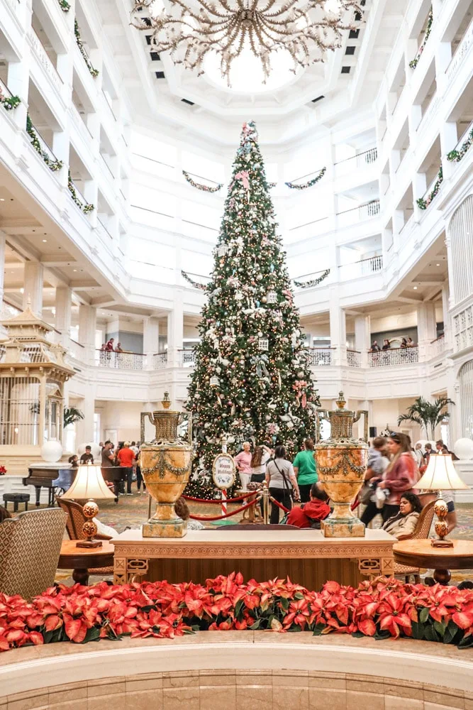 Victorian Christmas inspiration at Disney Grand Floridian with a 40' tall tree in the lobby adorned with large velvet bows, glass balls, birdcages, swans and much more.