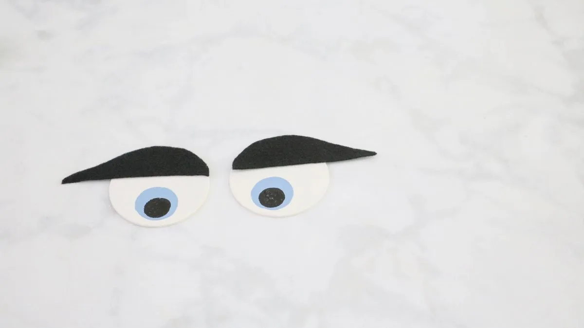 DIY life size nutcracker by making eyebrows for the eyes.