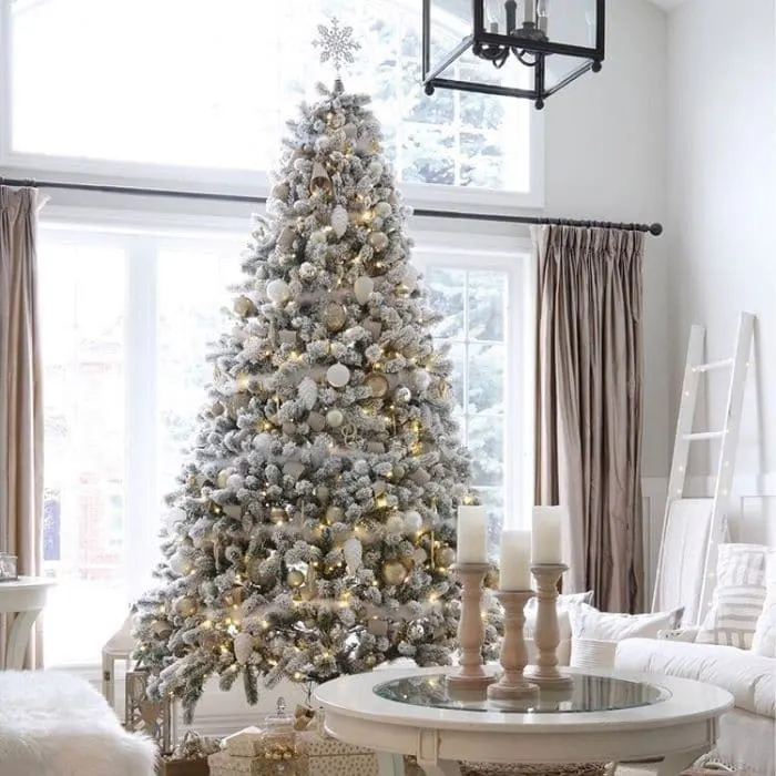 White Christmas Tree Ideas by Willow Bloom Home Blog featuring a white with gold accents on a white Christmas tree