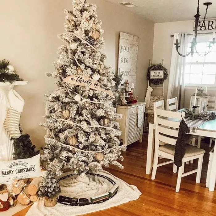 White Christmas Tree Ideas by Down Home Grace with a banner trimming a white decorated tree