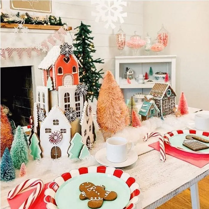 Decorating With Gingerbread Houses by The Revelry Co. with gingerbread houses as a table centerpiece