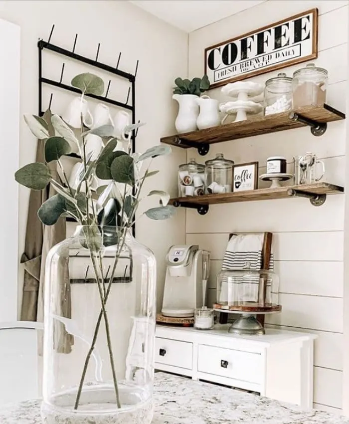 A coffee bar with floating shelves by Oak Hill Farms