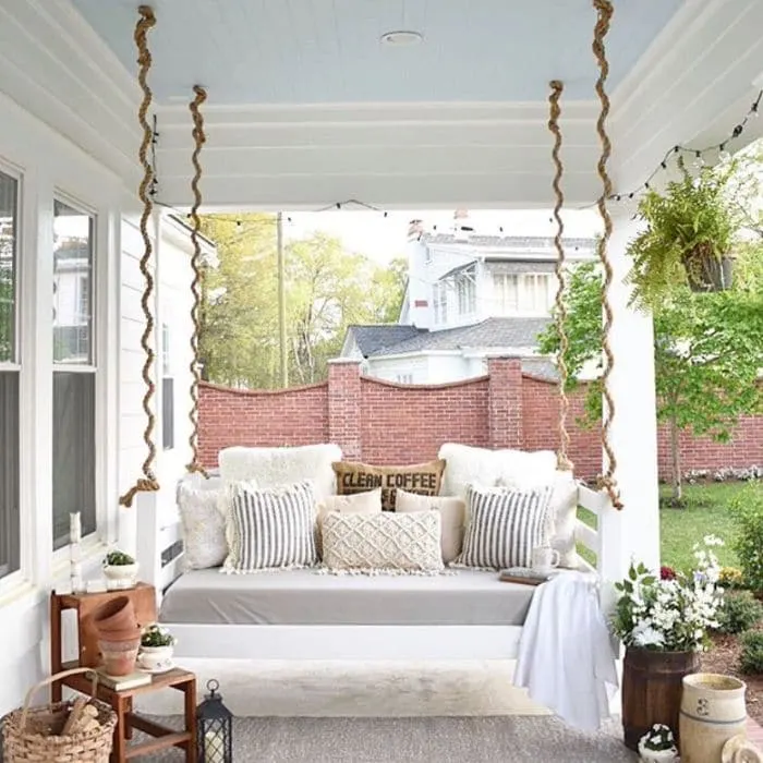 Porch Bed Swing Hanging from a Blue Ceiling from Simply Southern Cottage
