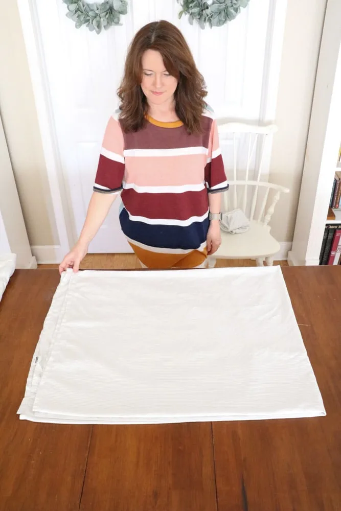 How to fold bed sheets neatly by folding the flat sheet the other way.