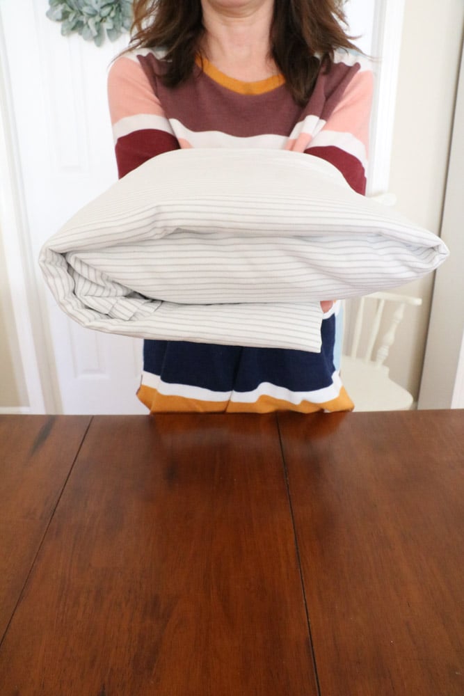 How to fold bed sheets neatly to save space in your linen closet.  Here is a folded sheet bundle example.