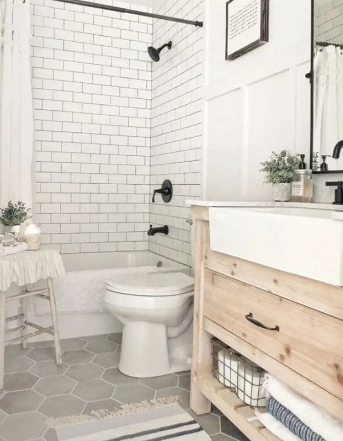 An apron sink in a small bathroom from The Sycamore Farmhouse