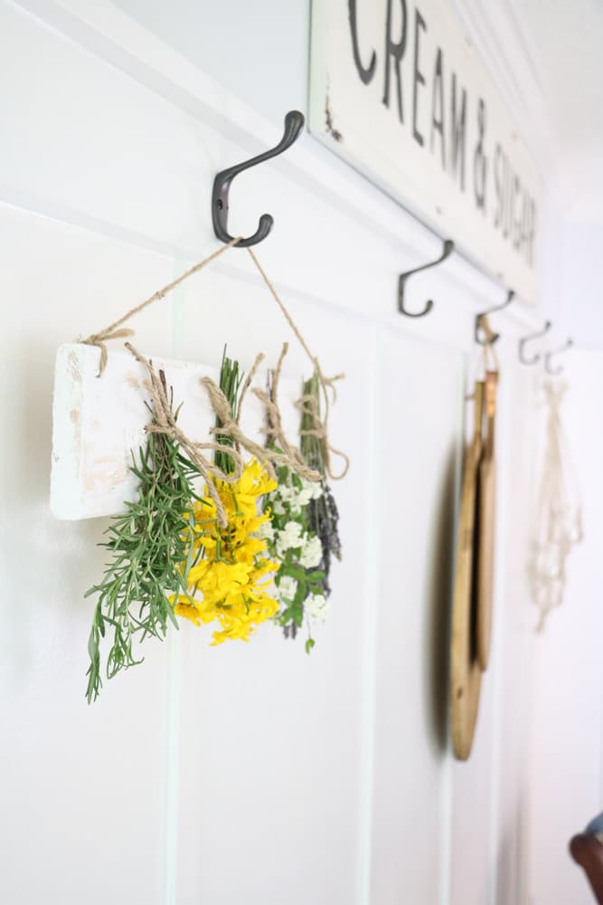 Dried flower wall hanging on board and bat