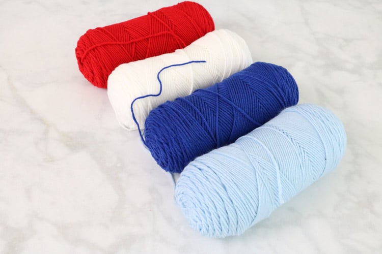 Red, white, navy and light blue yarn