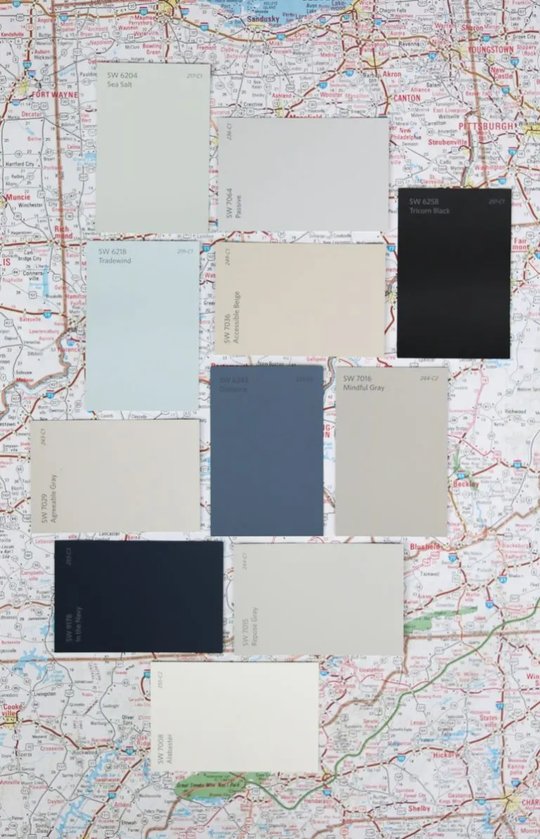 Popular Sherwin Williams paint samples sitting on a map.