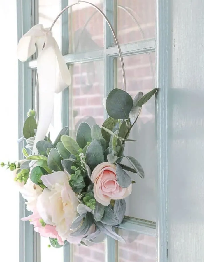 Front Door with a Semi-gloss finish in Wythe Blue by Benjamin Moore.  And a spring wire wreath with peonies, lambs ear leaves.