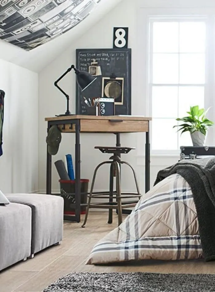 Decor for dorm rooms using music ideas like a tapestry of old speakers.
