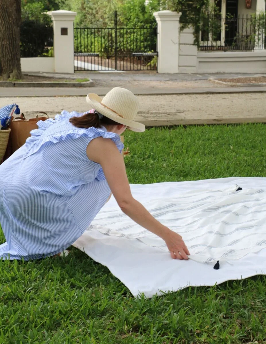 Patriotic picnic ideas using layered blankets on the ground.