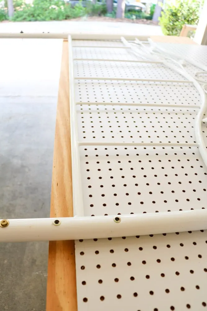 Making a upholstered headboard with a pegboard and old metal bed frame.