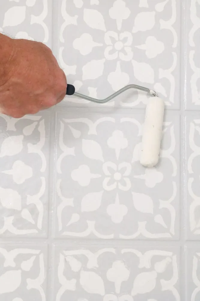 Paint a clear coat over the tile paint
