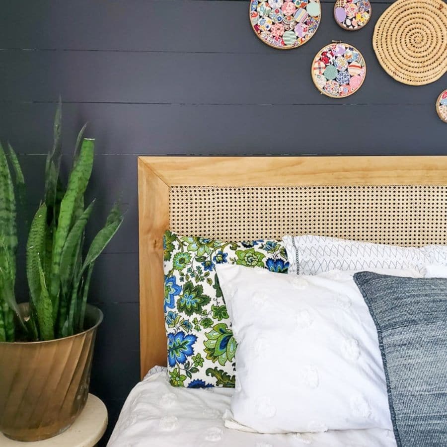 A DIY wooden headboard with caning.