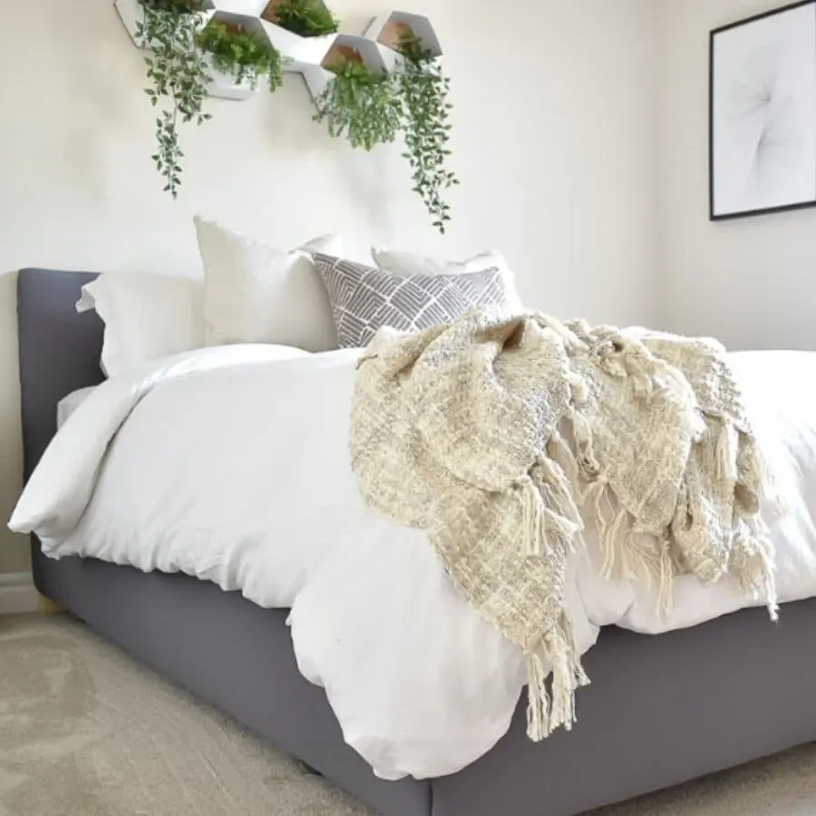 A DIY upholstered headboard made from a metal bed frame.