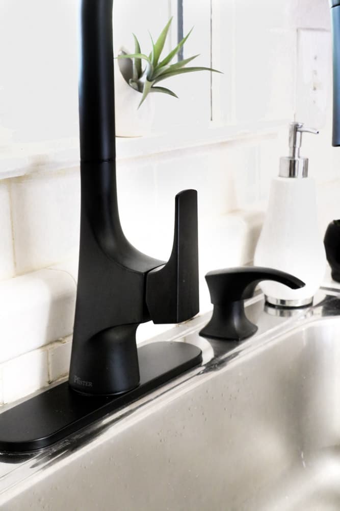 Matte black kitchen faucet with a deckplate
