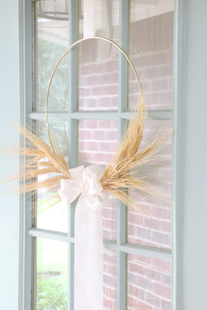 fall wreath diy using dried wheat, off white satin ribbon and a gold ring