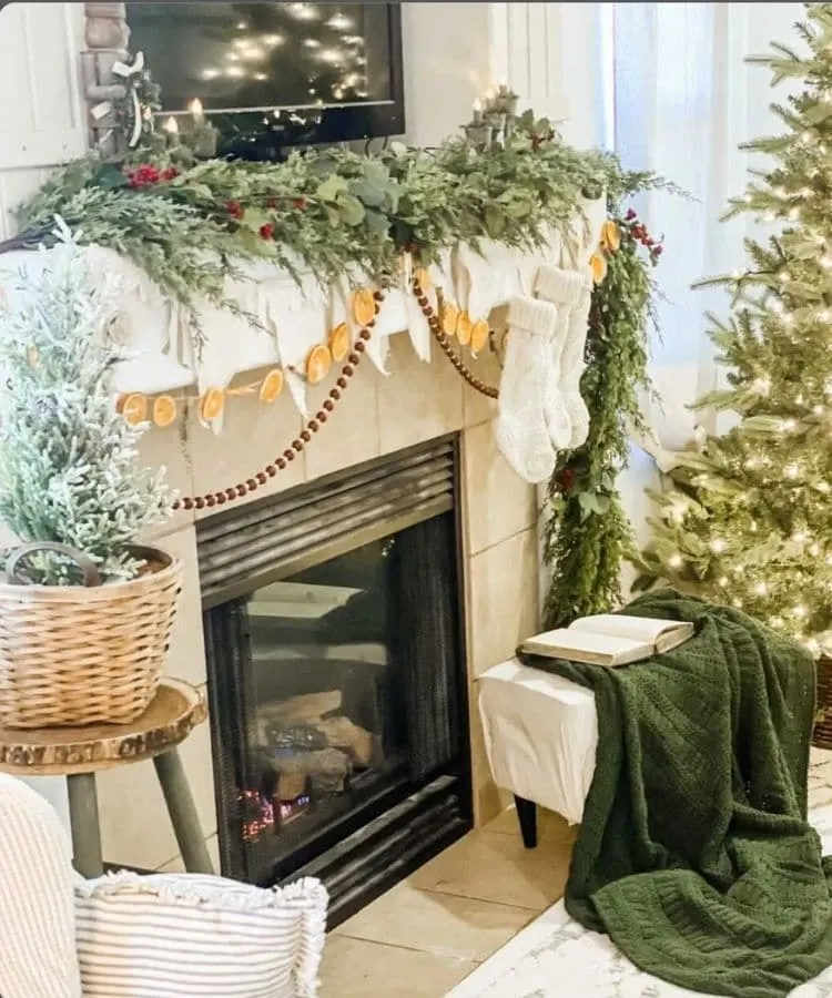 Cozy cottage fireplace mantel decorating idea for Christmas by The Charmed Cottage