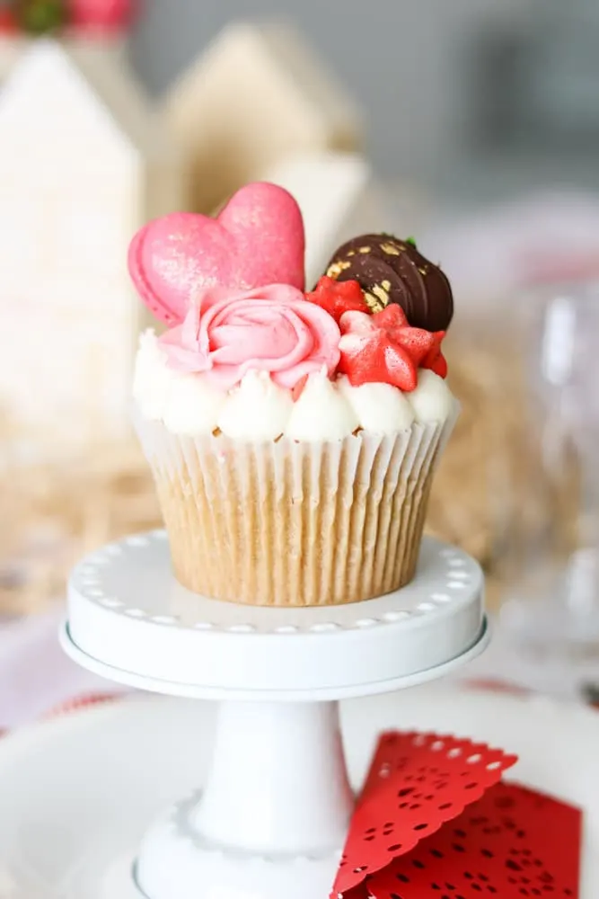 Valentine's day cupcake by Les Cherie place setting centerpiece on a family Valentine tablescape