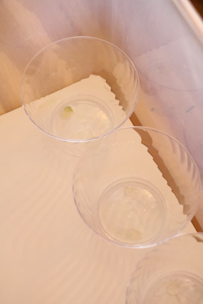 Glue clear cups onto foam board and place in storage drawers for Christmas ornaments