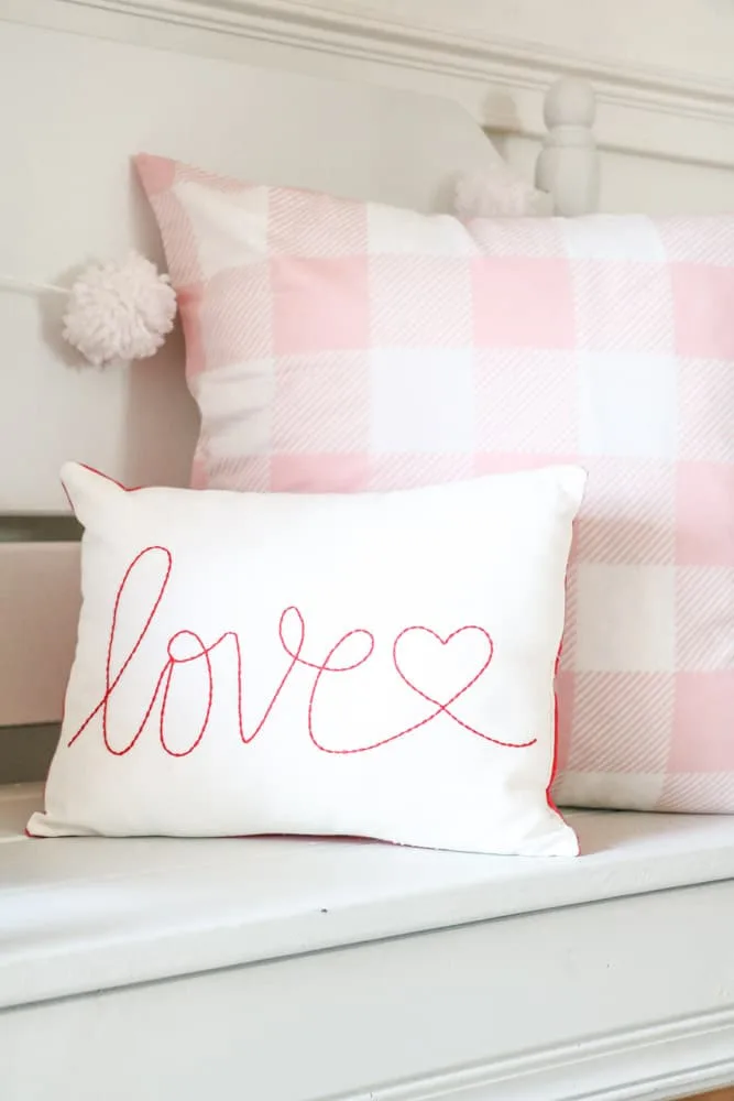 Valentine's Day Decor Ideas for your entryway with love and buffalo check pillows
