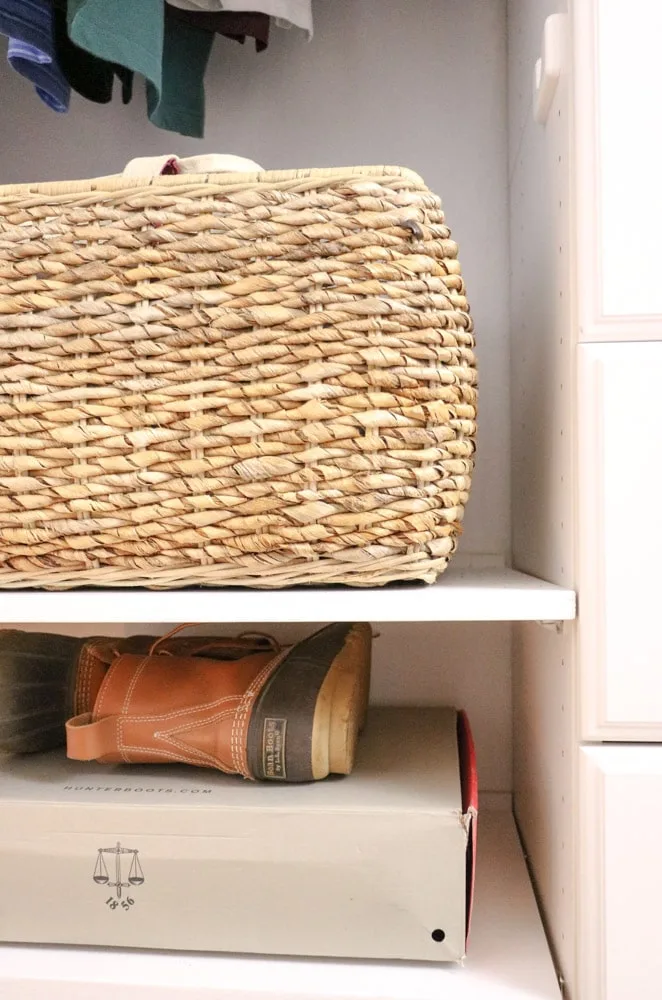 Basket storage on shelf in organized closet
