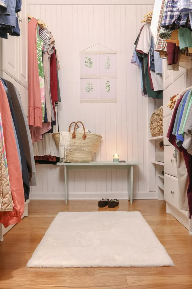 Organize clothes by color in small walk in closet