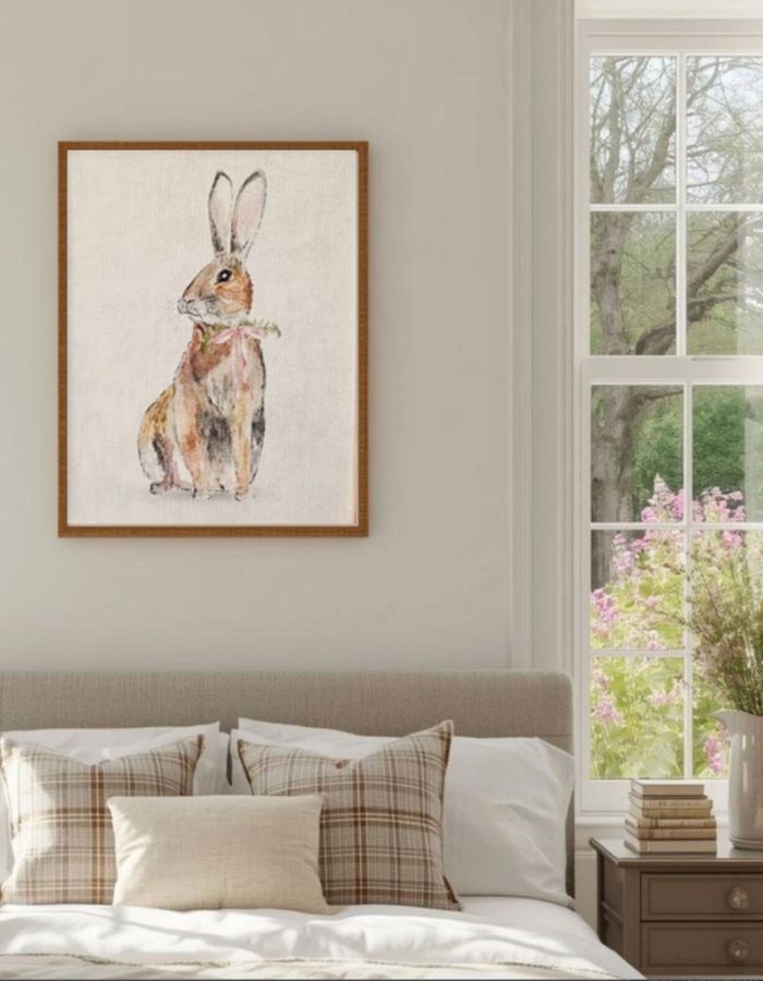 Bedroom with printable art on the wall over the bed of a watercolor bunny