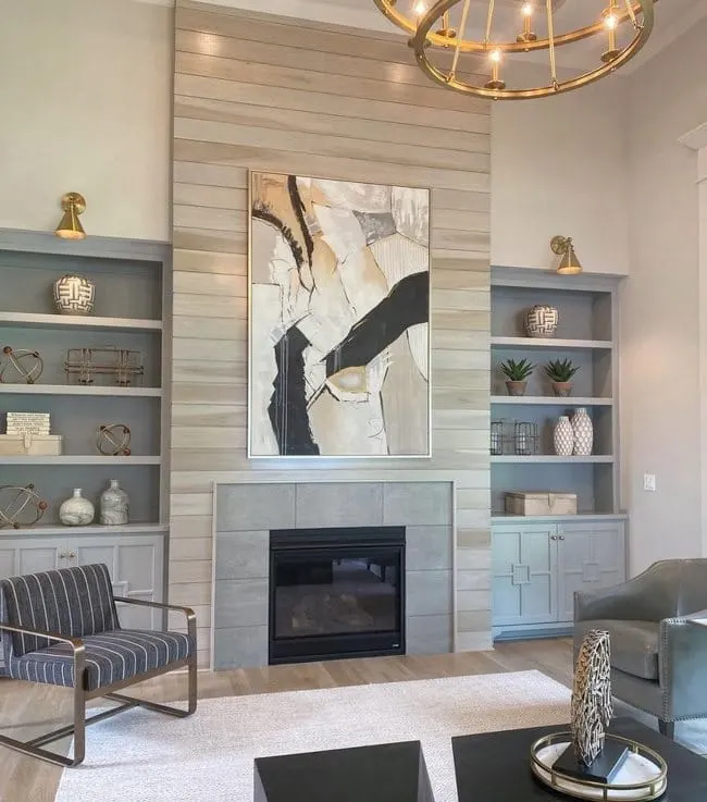 Built in cabinetry by a fireplace painted Sherwin Williams Gray Clouds