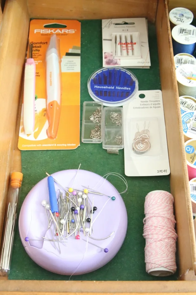 Organizing sewing supplies in a drawer