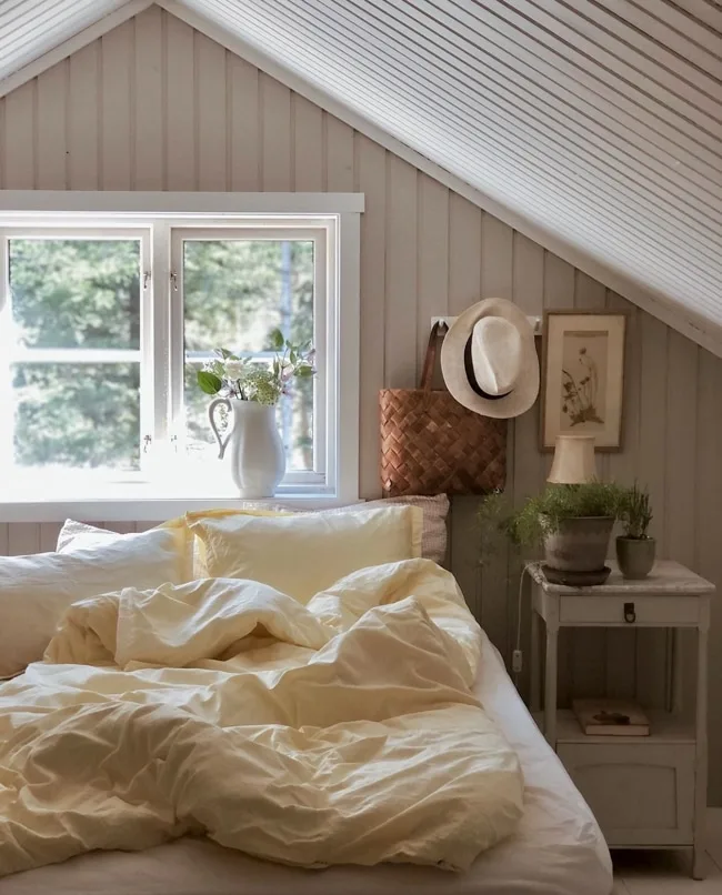 Bedroom decorated with beadboard walls and ceiling to get a cottagecore look