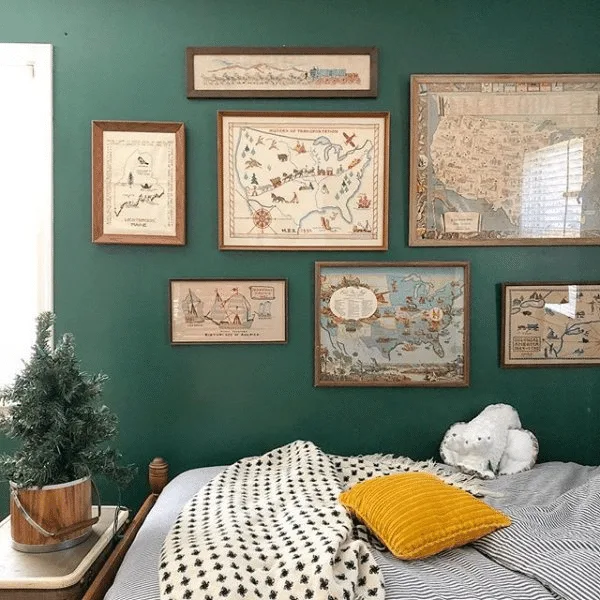 Trendy and popular Sherwin Williams dark green paint color Isle of Pines in a bedroom.