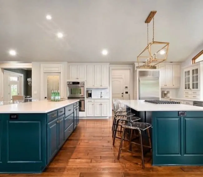 This kitchen have two large islands painted in Sherwin Williams Cascades green paint