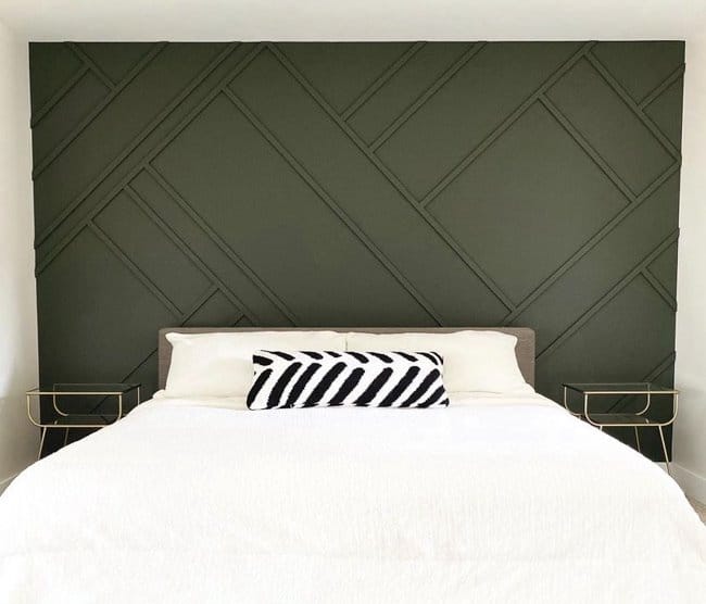 Bedroom wall painted in a deep Shade Grown green color