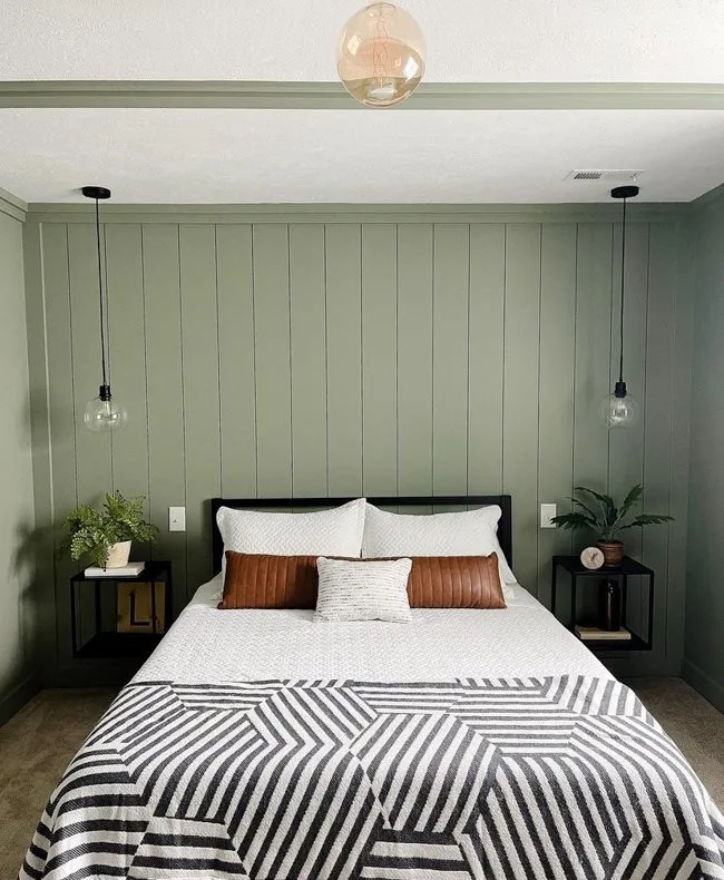 Sherwin Williams Evergreen Fog painted on shiplap on wall as headboard of bed