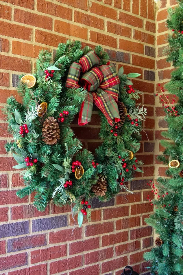Cottage farmhouse Christmas wreath on front porch