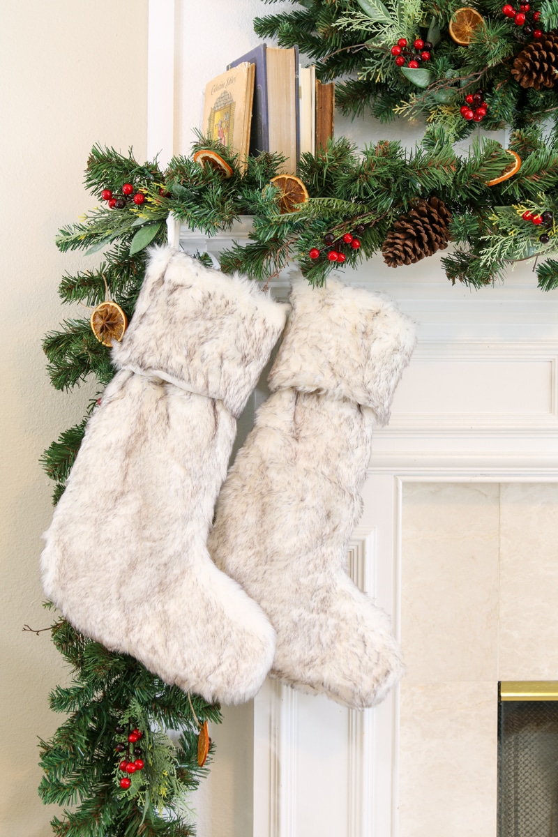 Fur stocking on a farmhouse Christmas mantel
