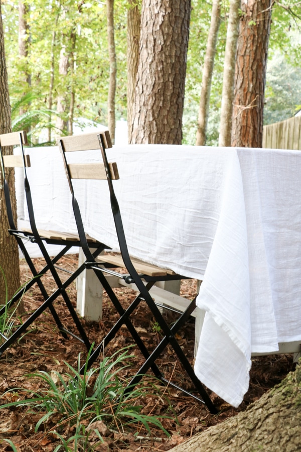 White tablecloth for an outdoor Halloween jack o lantern tablescape