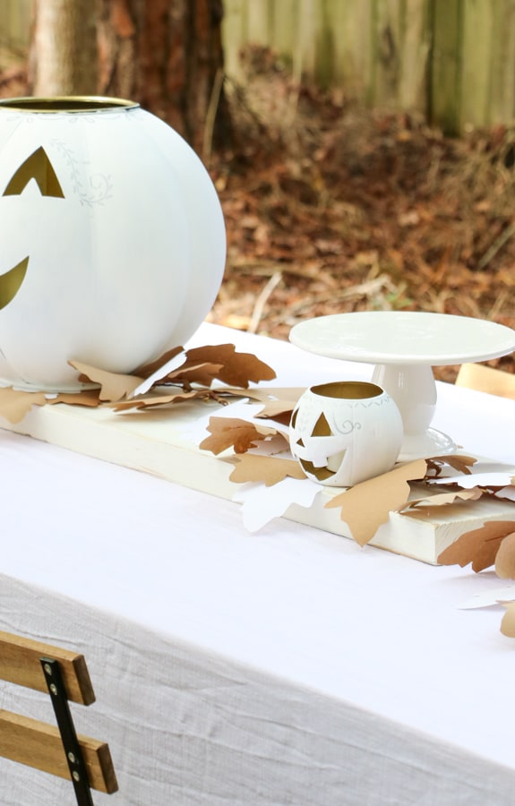 White jack o lantern centerpiece for a Halloween dinner party table
