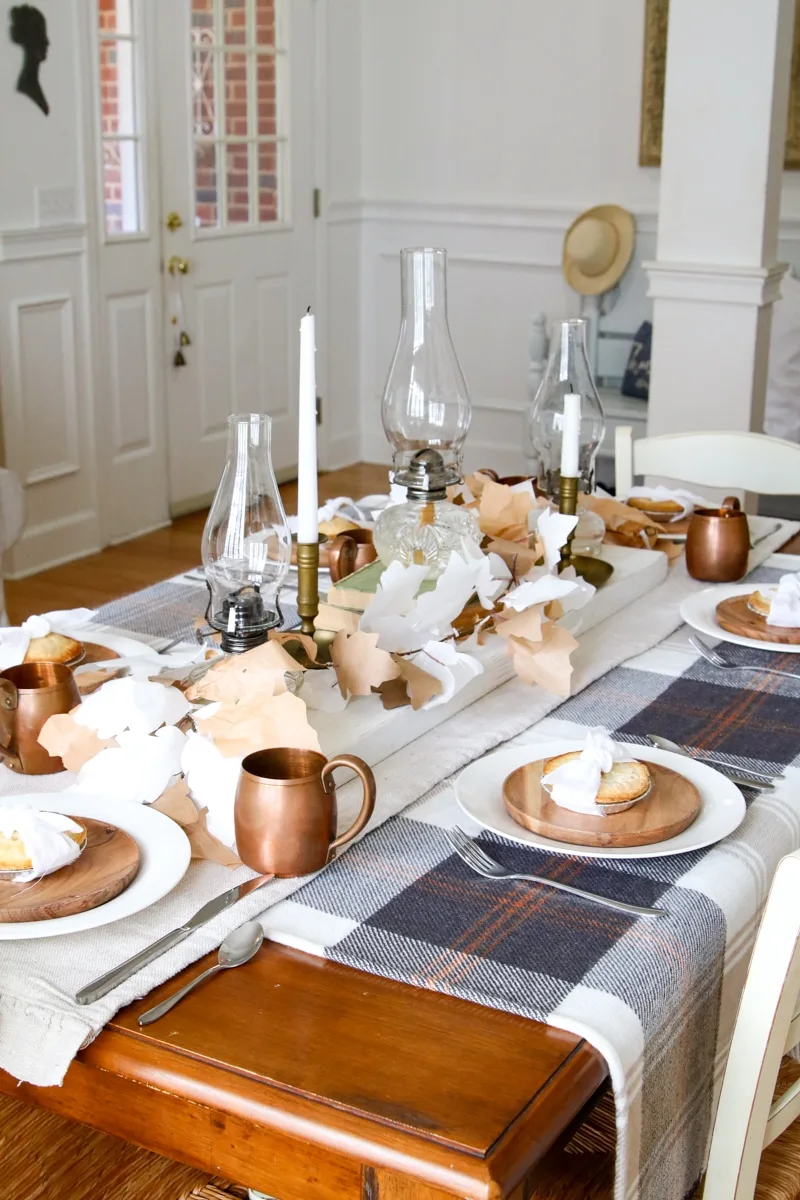simple Thanksgiving table with plaid, chamber lamps and mini pies