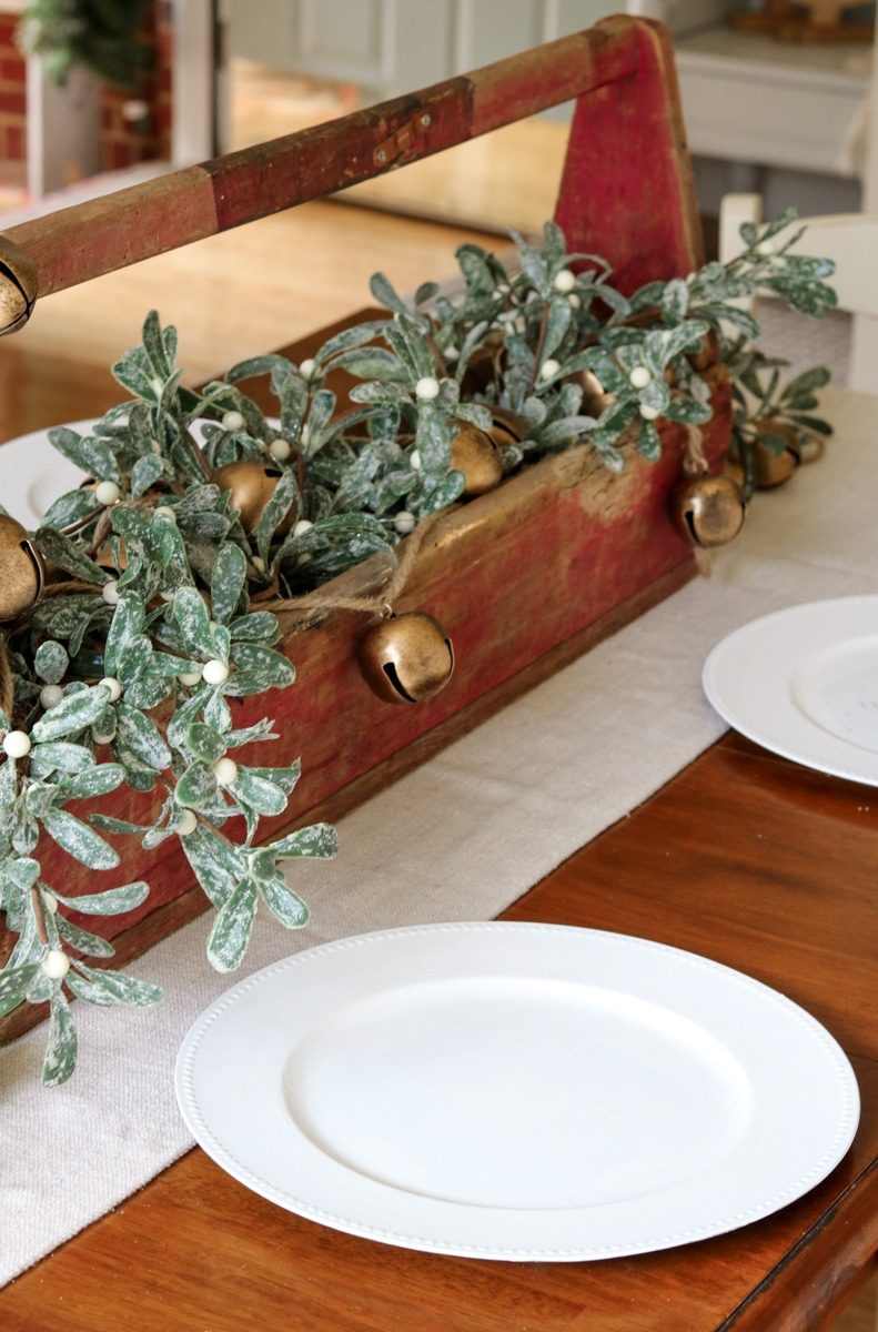Dollar tree chargers painted white for a vintage farm style Christmas table