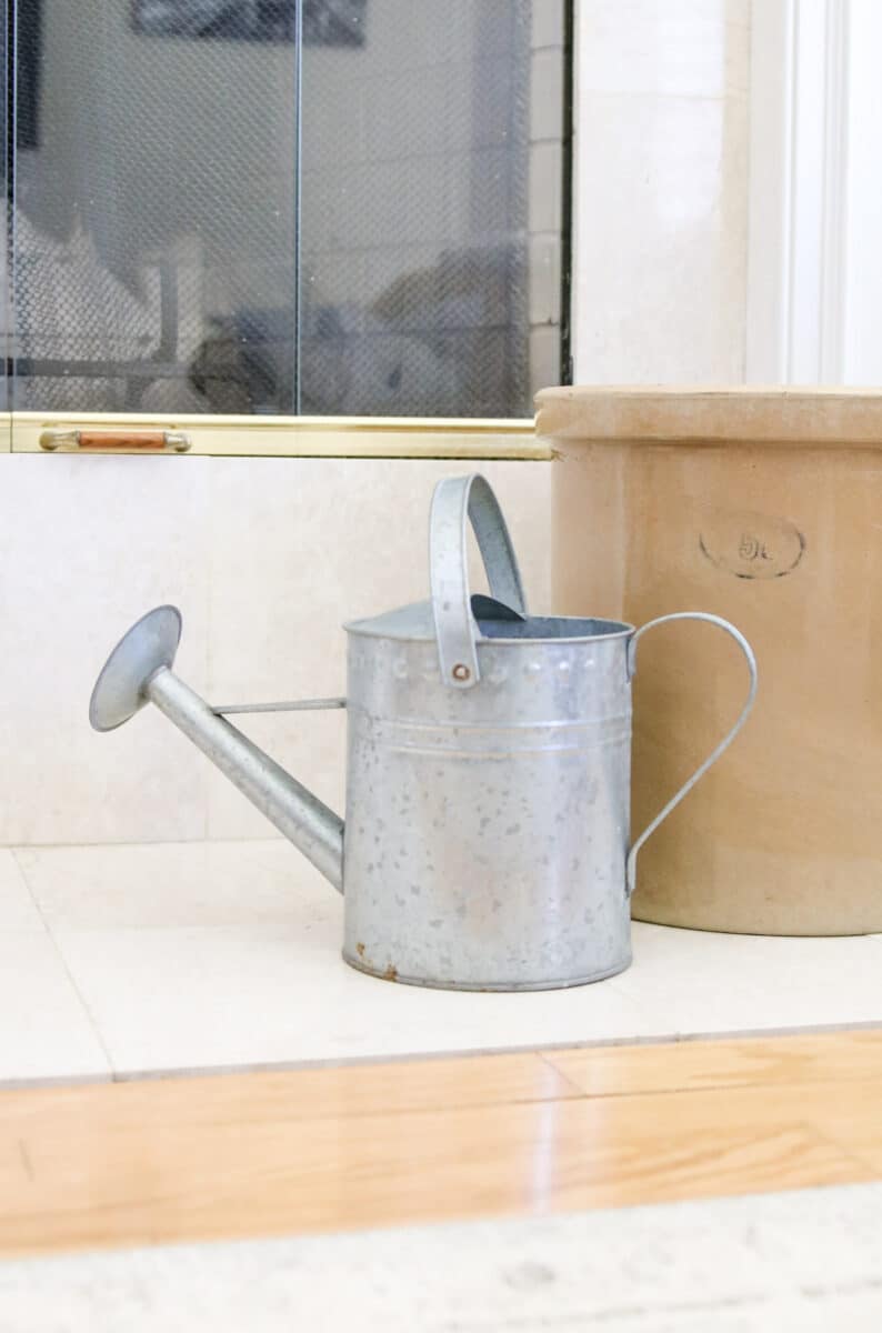 Garden watering can on hearth for decoration for spring