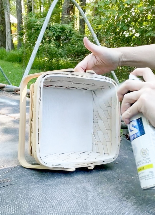 Spray painting the inside of a wicker basket