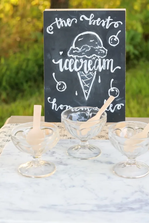 Sauce jars for an ice cream social and a sign on chalkboard