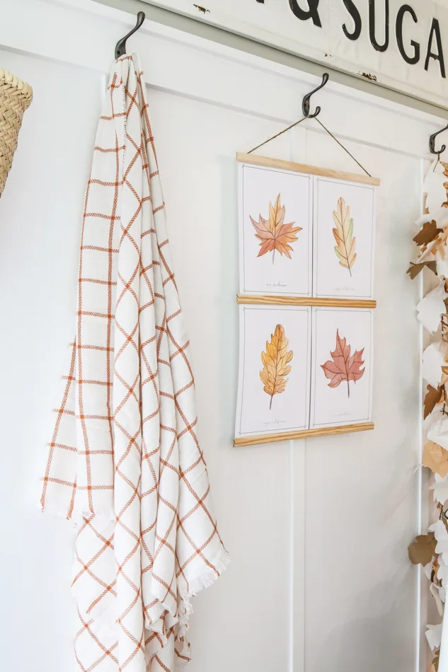 Blanket hanging on hooks as decorations for fall