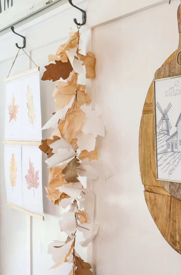 Paper leaf garland hanging on hooks in a farmhouse style kitchen
