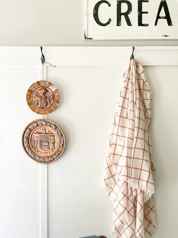 Decorating your kitchen with copper and blanket hanging on a hook